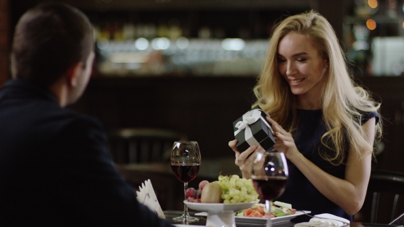 Smiling Cute Lady Getting a Present To Valentines Day