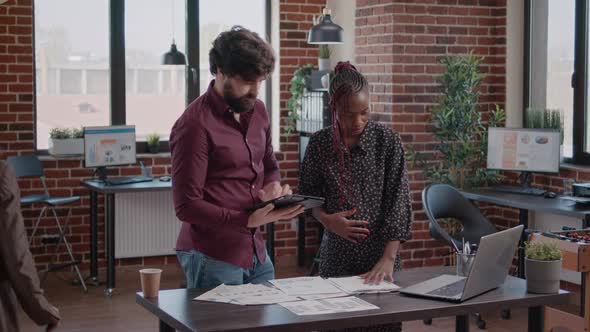 Business Man with Tablet Talking to Pregnant Colleague