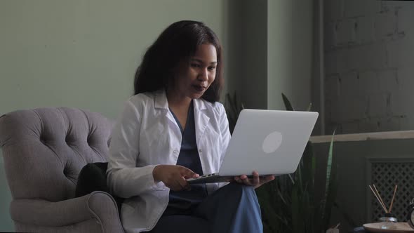 Female African Doctor Talking on Conference Video Call