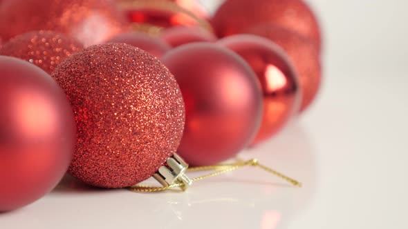 Red Christmas baubles shallow DOF 4K tilting video