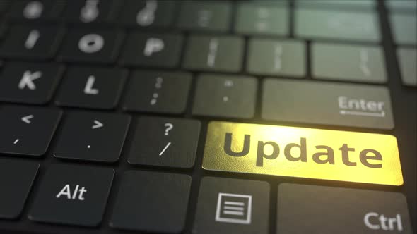 Black Computer Keyboard and Gold Update Key