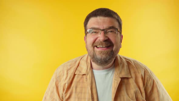 Caucasian happy man laughing out loud, hilarious laughter, making fun of ridiculous appearance