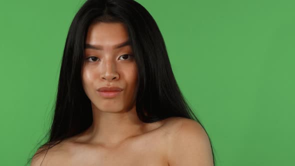 Gorgeous Young Asian Woman Looking Not Impressed and Disappointed