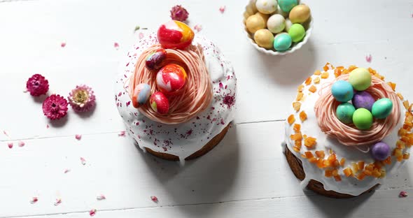 Easter cake with chocolate eggs decoration, on white wooden table