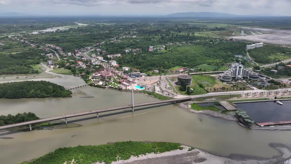 Anaklia, Georgia - July 16 2022: Aerial view of Anaklia-Ganmuhkuri Pedestrian Bridge at sunset