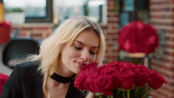 Portrait of Romantic Beautiful Woman Smiling and Smelling Roses Feeling in Love Admiring Luxury Gift