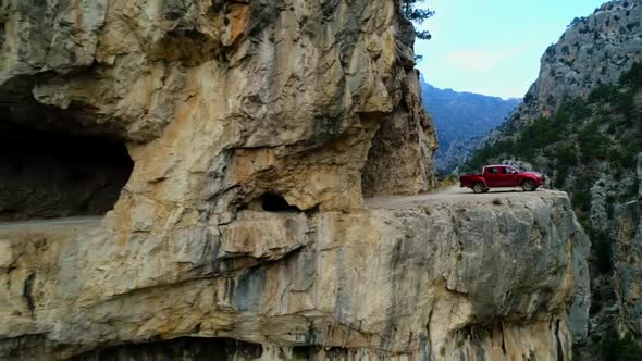 Off-Road Vehicle on the Edge of the Cliff