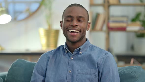 Young African Man Shaking Head in Approval 