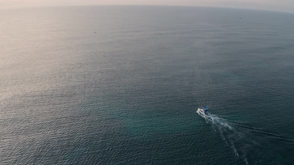 Deep sea fishing motor boat at sunrise at Watamu, Malindi, Kenya. Aerial drone view