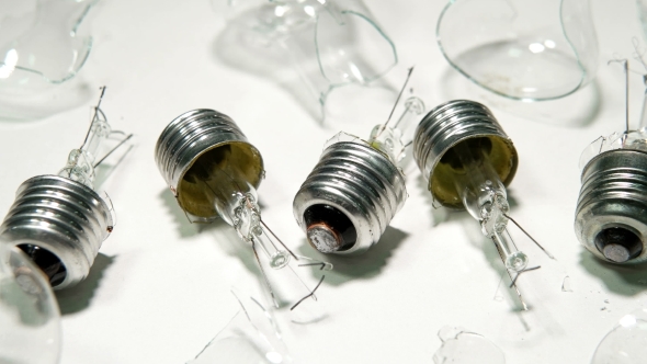 Broken Light Bulbs and Glass on a White Background