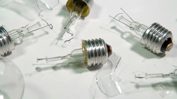 Broken Light Bulbs and Glass on a White Background