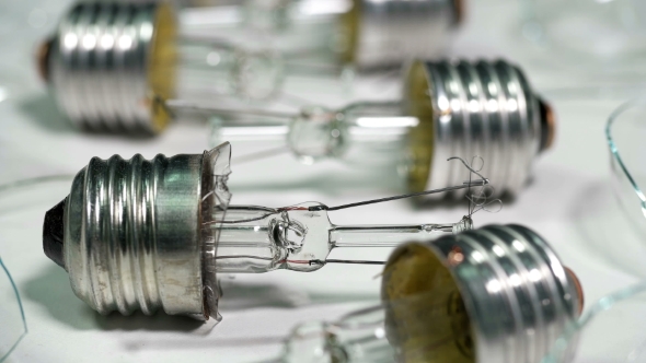 Broken Light Bulbs and Glass on a White Background