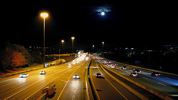 Busy City Road With Full Moon