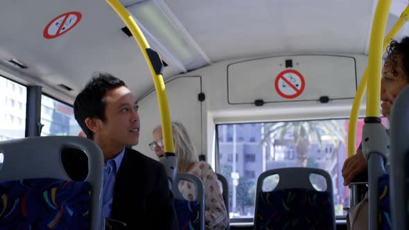 Commuters interacting with each other while travelling in bus 4k