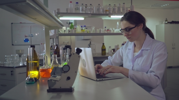 Portrait Doctor Working with Laptop in Laboratory