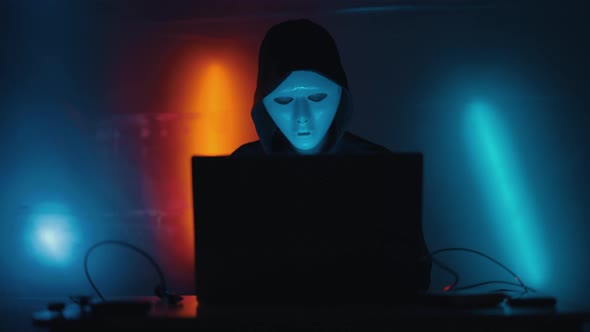 Hacker is Working on Laptop at Night