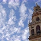 Low angle shot of the Cordoba Mosque Tower with a sky full of white clouds - VideoHive Item for Sale