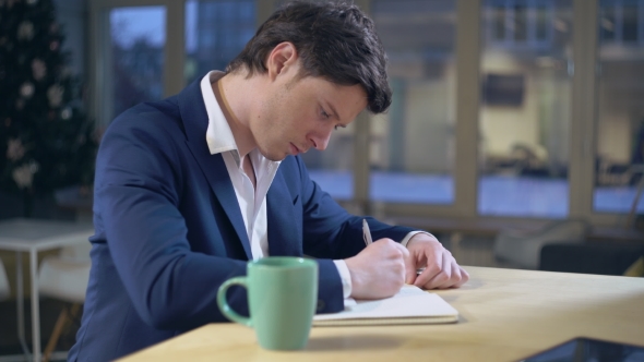 Businessman Handwriting Holding Pen