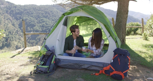 Two People Having Rest in Tent