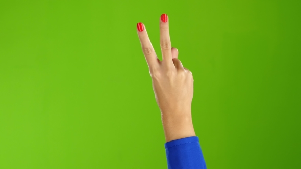 . Gesture of Peace Shows Hand Woman Twice Per Frame