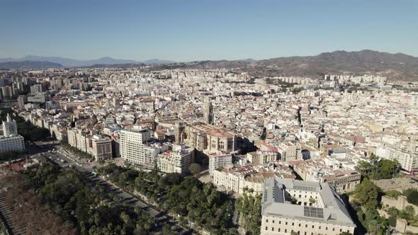 Aerial view Spanish city of malaga, Sprawling Cityscape with mountain as background