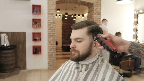 Barber Working with Electric Razor