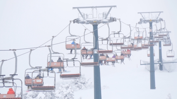 Lift at Ski Resort Transports Skiers