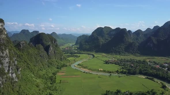 Aerial Panorama Green Valley with Long River and Mountains