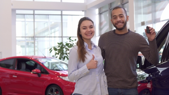 Couple Buys Car at the Dealership