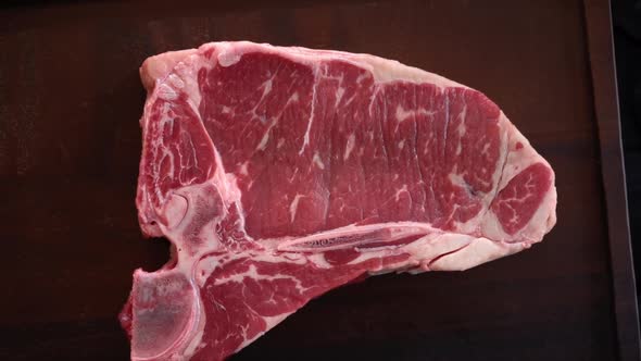 Rotating Tbone Steak  Raw Marble Beef Fillet Aged Prime Rare Delicious Juicy Meat