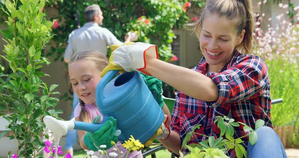 Mother and Daughter Gardening Together