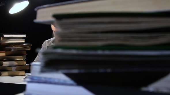 Guy in the Lamplight, and Reading a Book. Black Background