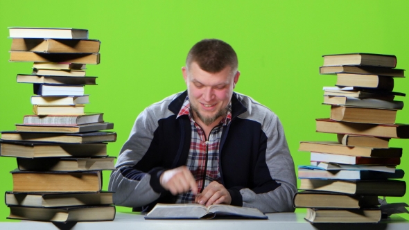 Guy Suddenly Finds His Article in the Book and Is Very Happy. Green Screen