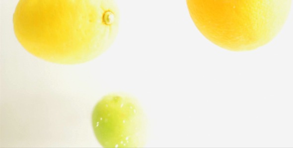 Citrus Fruits Are Dropped Into Water