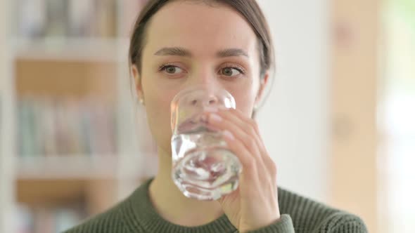 Portrait of Young Woman Drinking Water Glass