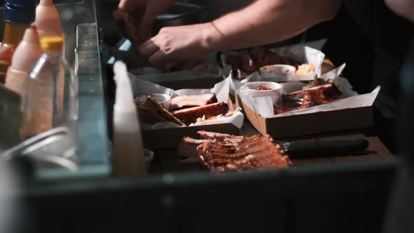 Cook making dishes with meal. Meat and toppings. BBQ