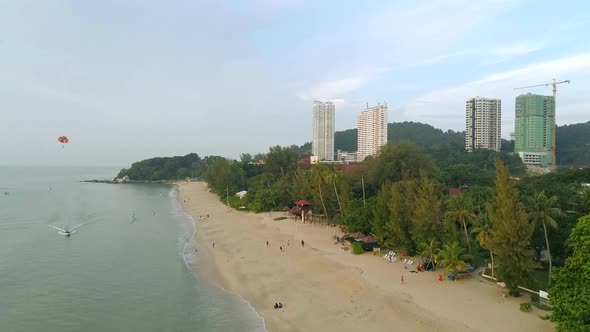 A drone shot of the beach at Batu Ferringhi on Penang, Malaysia.