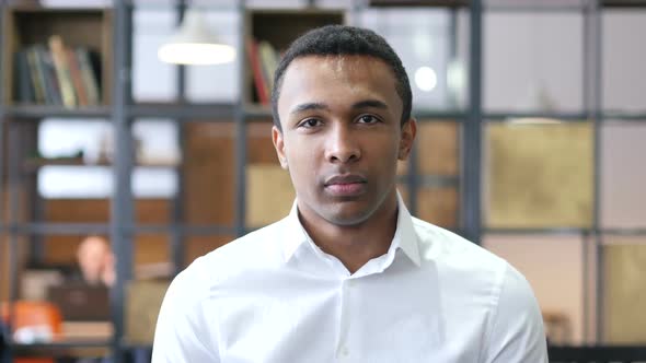 Serious Black Man in Office