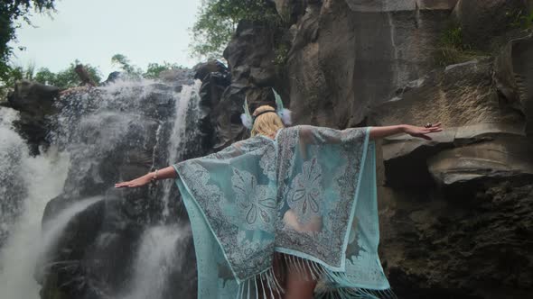 Waterfall and Ethnic Style Woman in Wild Forest