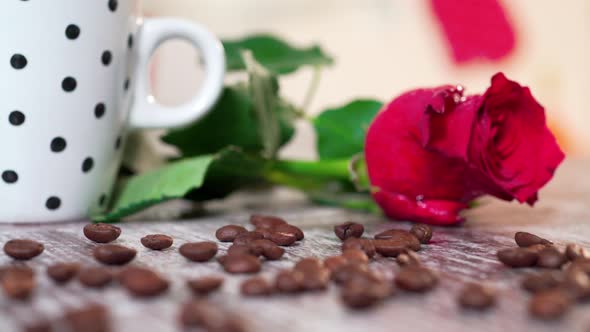 White Cup Filled With Coffee With A Rose