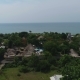 Aerial Shot of the Tropical Bay with Stony Beach, Boats and Buildings. - VideoHive Item for Sale