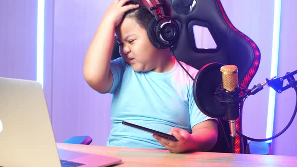 Asian Little Boy Playing Video Game With Phone Then Lose The Game And Talking To Camera