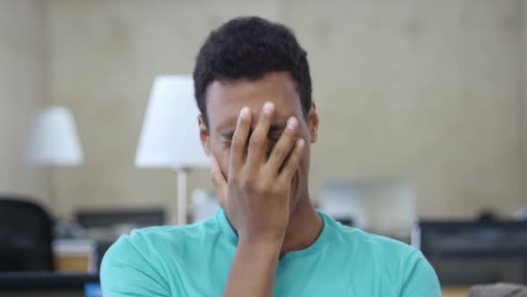 Sleepy Yawing Black Young Man in Office, Portrait