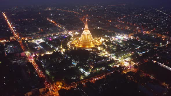 Aerial top view of Phra Pathommachedi temple at night in Nakorn Pathom district, Thailand.