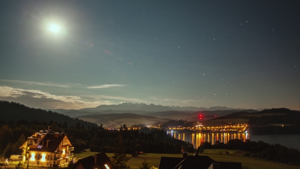 Night  with Moon, Stars, Clouds, Mountains and Village Near the Lake