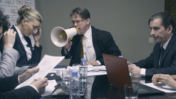 Mad Boss Yelling at Employees with a Megaphone