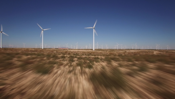 Flying Backward Over Windmill Farm