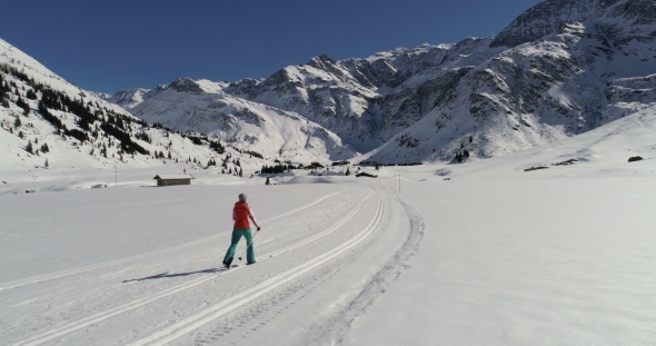 Aerial View of Woman Skiing on Groomed Trail