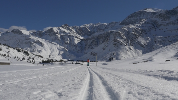 Fit Woman Crosscountry Skiing on Highlands