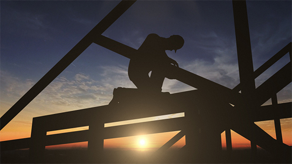 Silhouette Of Construction Worker On Roof Top alt